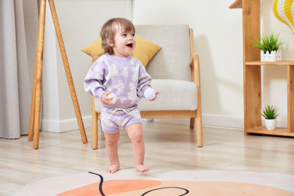 KNITTED SPOTS ROMPER WITH BLOOMERS - TARO; 100% Organic Cotton; Jacquard Romper made from GOTS-certified organic cotton; 'TARO SPOTS' Jacquard pattern; Rib hem at neck, cuffs and leg opening; Features convenient press snaps at the crotch for effortless dressing; Oversized fit.