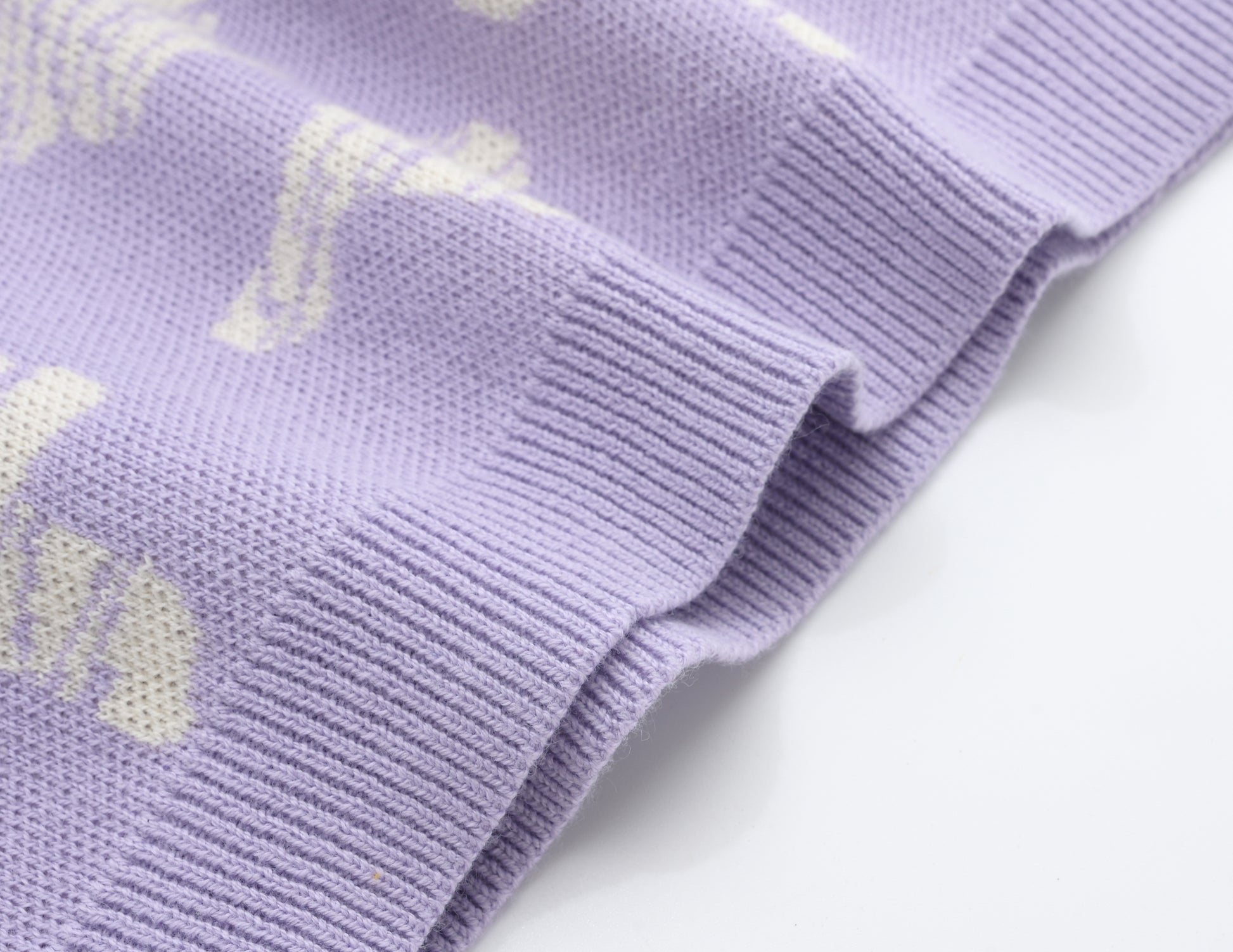 KNITTED SPOTS PULL OVER - TARO; 100% Organic Cotton; Jacquard Pull Over made from GOTS-certified organic cotton; 'Taro Spots' Jacquard pattern; Rib finish at neck, cuffs and hem; Dropped shoulder; Relaxed fit.