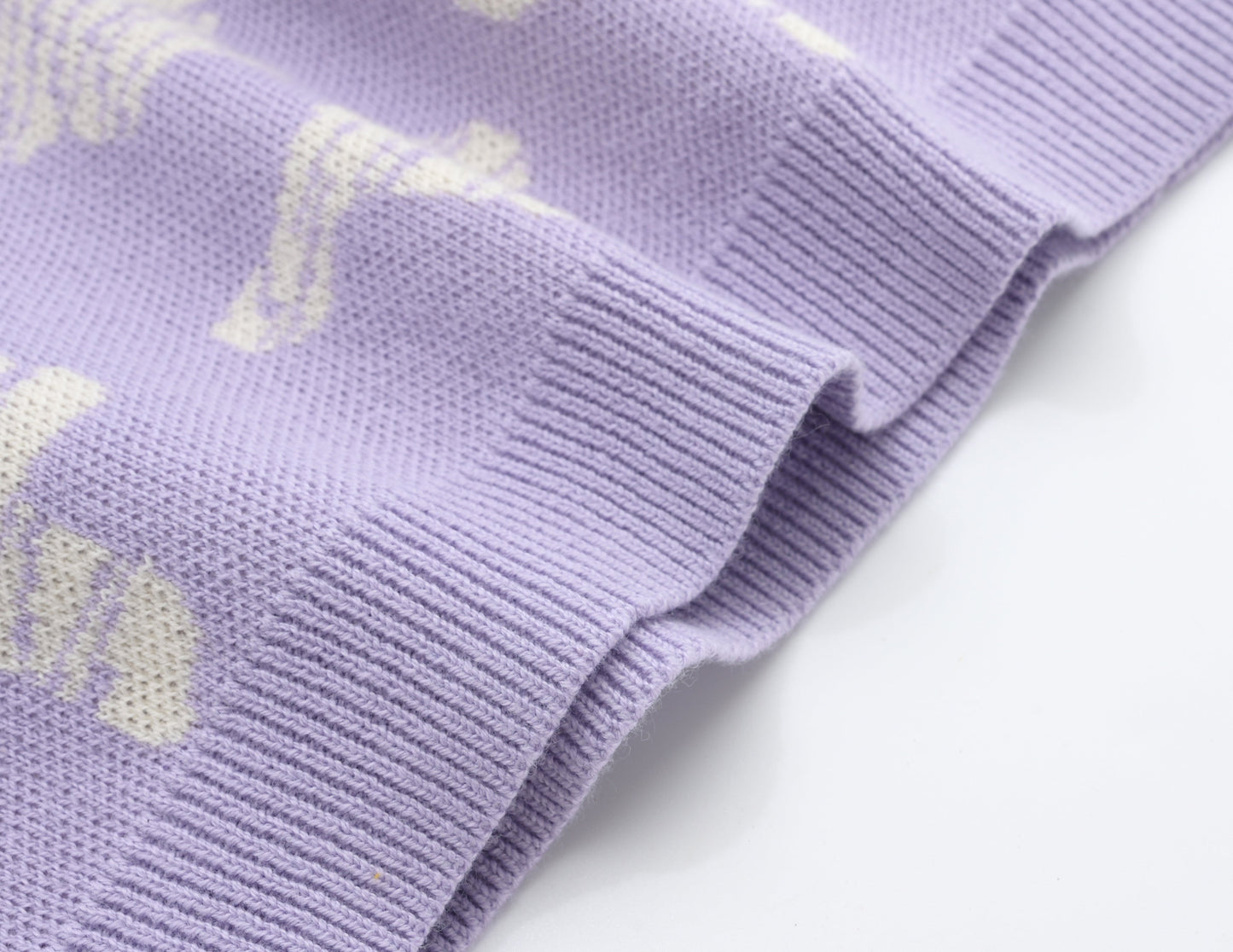 KNITTED SPOTS PULL OVER WITH PANT - TARO; 100% Organic Cotton; Jacquard Pull Over made from GOTS-certified organic cotton; 'Taro Spots' Jacquard pattern; Rib finish at neck, cuffs and hem; Dropped shoulder; Relaxed fit.