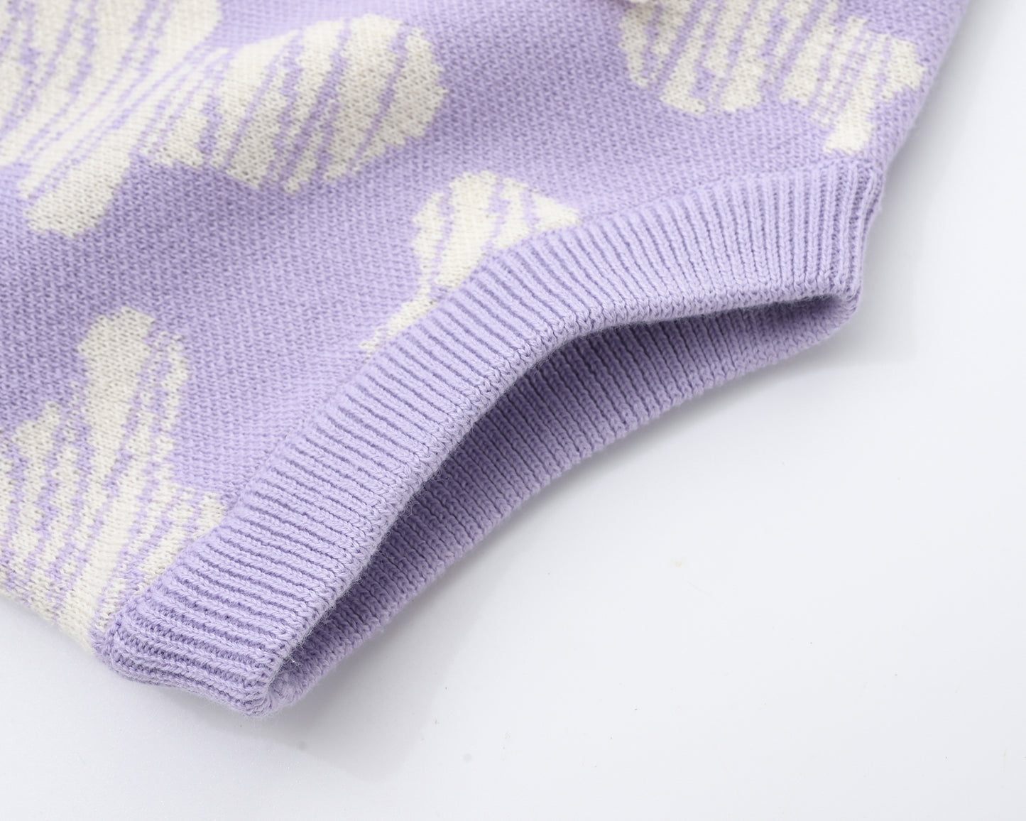 KNITTED SPOTS ROMPER WITH BLOOMERS - TARO; 100% Organic Cotton; Jacquard Romper made from GOTS-certified organic cotton; 'TARO SPOTS' Jacquard pattern; Rib hem at neck, cuffs and leg opening; Features convenient press snaps at the crotch for effortless dressing; Oversized fit.