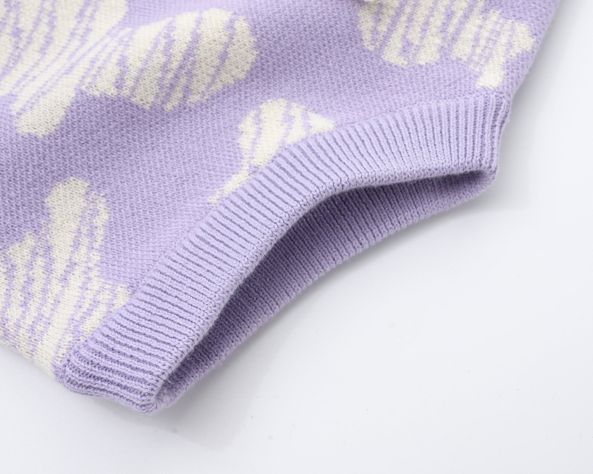 KNITTED SPOTS ROMPER WITH BLOOMERS - TARO; 100% Organic Cotton; Jacquard Romper made from GOTS-certified organic cotton; 'TARO SPOTS' Jacquard pattern; Rib hem at neck, cuffs and leg opening; Features convenient press snaps at the crotch for effortless dressing; Oversized fit.