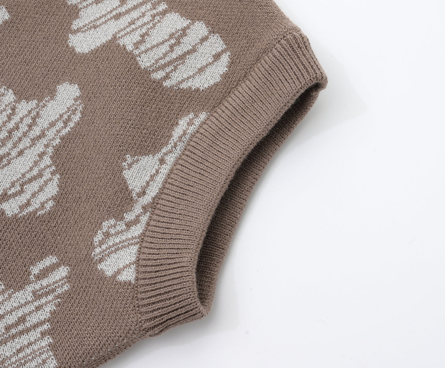 KNITTED SPOTS ROMPER WITH BLOOMERS - CHOCO; 100% Organic Cotton; Jacquard Romper made from GOTS-certified organic cotton; 'CHOCO SPOTS' Jacquard pattern; Rib hem at neck, cuffs and leg opening; Features convenient press snaps at the crotch for effortless dressing; Oversized fit.