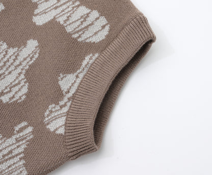 KNITTED SPOTS ROMPER WITH BLOOMERS - CHOCO; 100% Organic Cotton; Jacquard Romper made from GOTS-certified organic cotton; 'CHOCO SPOTS' Jacquard pattern; Rib hem at neck, cuffs and leg opening; Features convenient press snaps at the crotch for effortless dressing; Oversized fit.