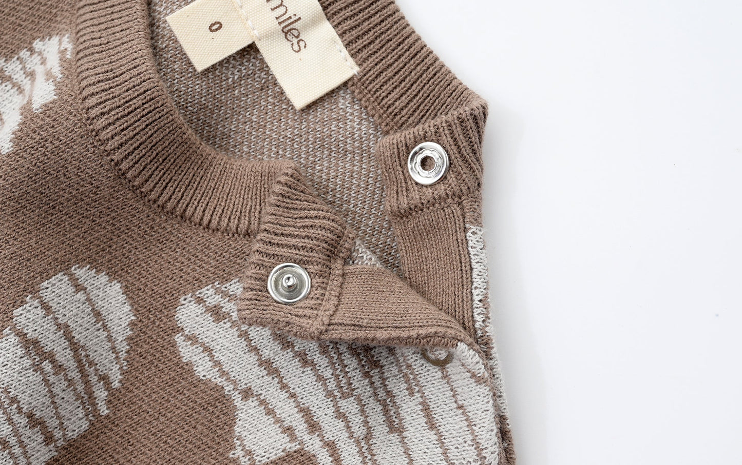 KNITTED SPOTS ROMPER WITH BLOOMERS - CHOCO; 100% Organic Cotton; Jacquard Romper made from GOTS-certified organic cotton; 'CHOCO SPOTS' Jacquard pattern; Rib hem at neck, cuffs and leg opening; Features convenient press snaps at the crotch for effortless dressing; Oversized fit.