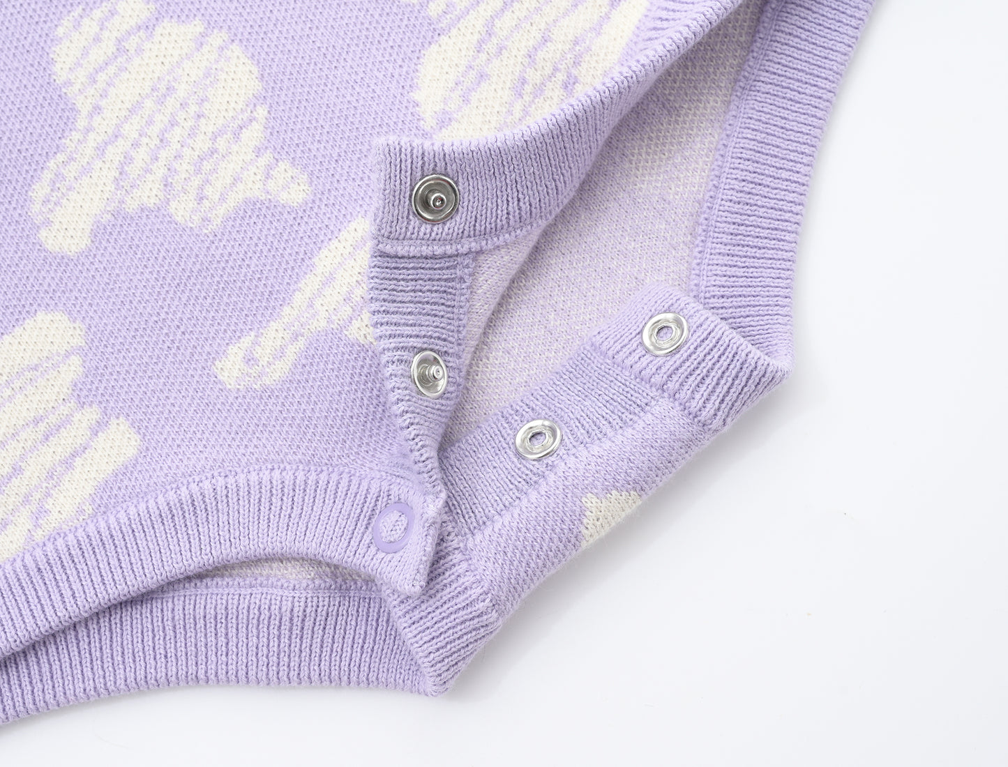 KNITTED SPOTS ROMPER WITH BLOOMERS - TARO; 100% Organic Cotton; Jacquard Romper made from GOTS-certified organic cotton; 'TARO SPOTS' Jacquard pattern; Rib hem at neck, cuffs and leg opening; Features convenient press snaps at the crotch for effortless dressing; Oversized fit.