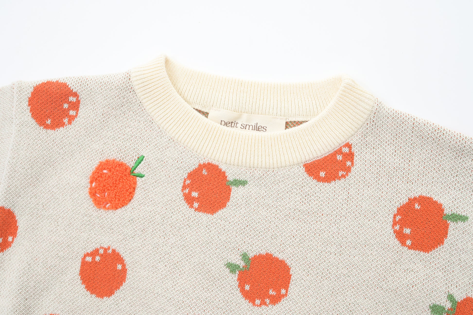 BABIES & KIDS KNITTED PULL OVER - CNY; 100% Organic Cotton; Jacquard Pull Over made from GOTS-certified organic cotton; 'Tangerine' Jacquard pattern with some towel embroidery artwork techniques; Rib finish at neck, cuffs and hem; Dropped shoulder; Relaxed fit; The younger model wears size 0; older model wears size 4.